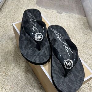Michael Kors Black Sandals with Silver Logo
(Used - like new)